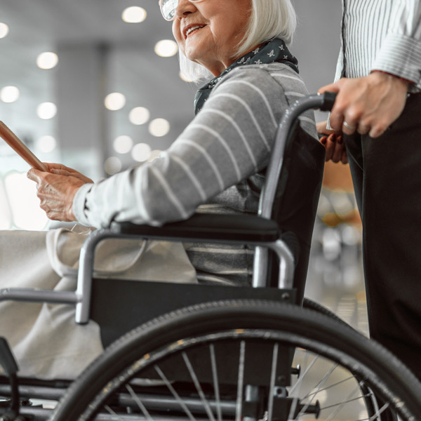 woman being pushed around in wheelchair